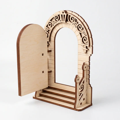 Isometric view of open laser cut plywood fairy door archway showing front steps and ornate banister on white backdrop.