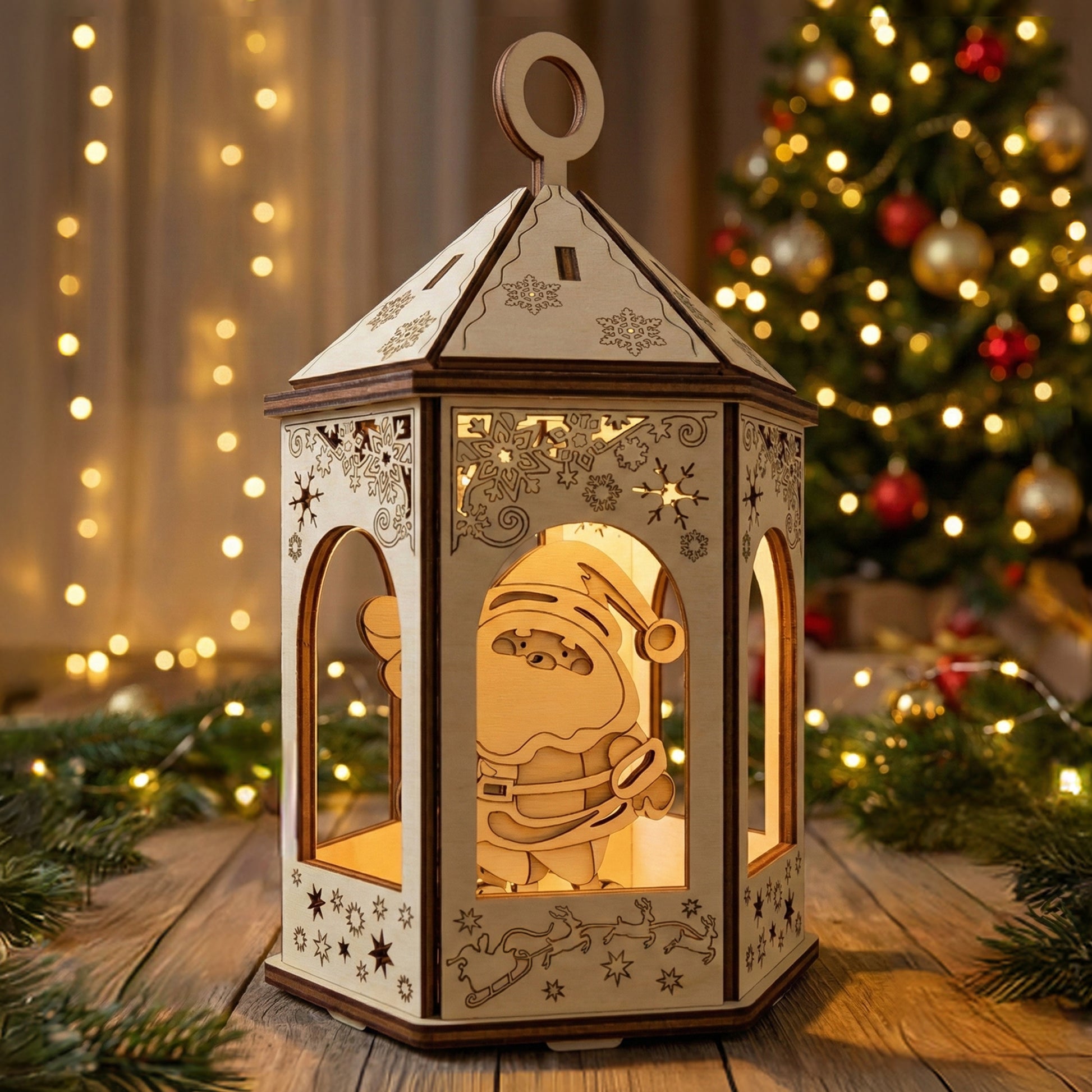 Wooden laser cut Christmas gazebo lantern featuring a cheerful Santa inside, intricate snowflake and reindeer cutouts, and a warm inner glow, displayed against a softly blurred Christmas tree background.