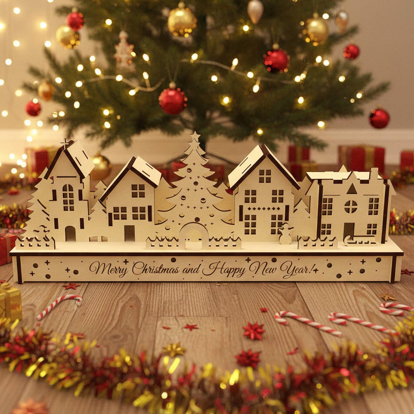 
Laser cut wooden Christmas houses village with snow-covered roofs, a central Christmas tree, and "Merry Christmas and Happy New Year" engraving, displayed against a softly blurred Christmas tree background.