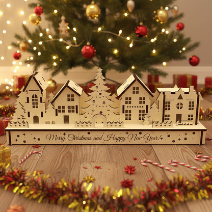 
Laser cut wooden Christmas houses village with snow-covered roofs, a central Christmas tree, and "Merry Christmas and Happy New Year" engraving, displayed against a softly blurred Christmas tree background.