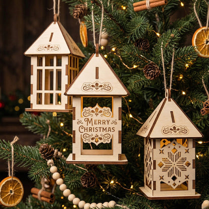 Three unique 3D laser-cut wooden lantern ornaments hanging together on a Christmas tree. One features a "Merry Christmas" engraving, another has snowflake cutouts, and the third a lattice frame. All are illuminated with a soft warm light for a cozy festive atmosphere.
