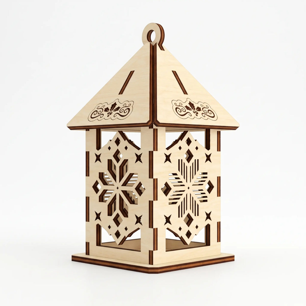 Detailed laser cut plywood lantern ornament with carved geometric snowflake pattern on plain white.