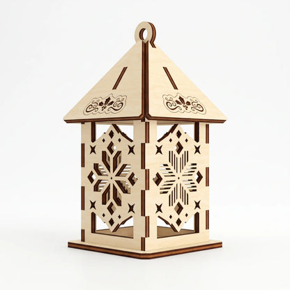 Detailed laser cut plywood lantern ornament with carved geometric snowflake pattern on plain white.