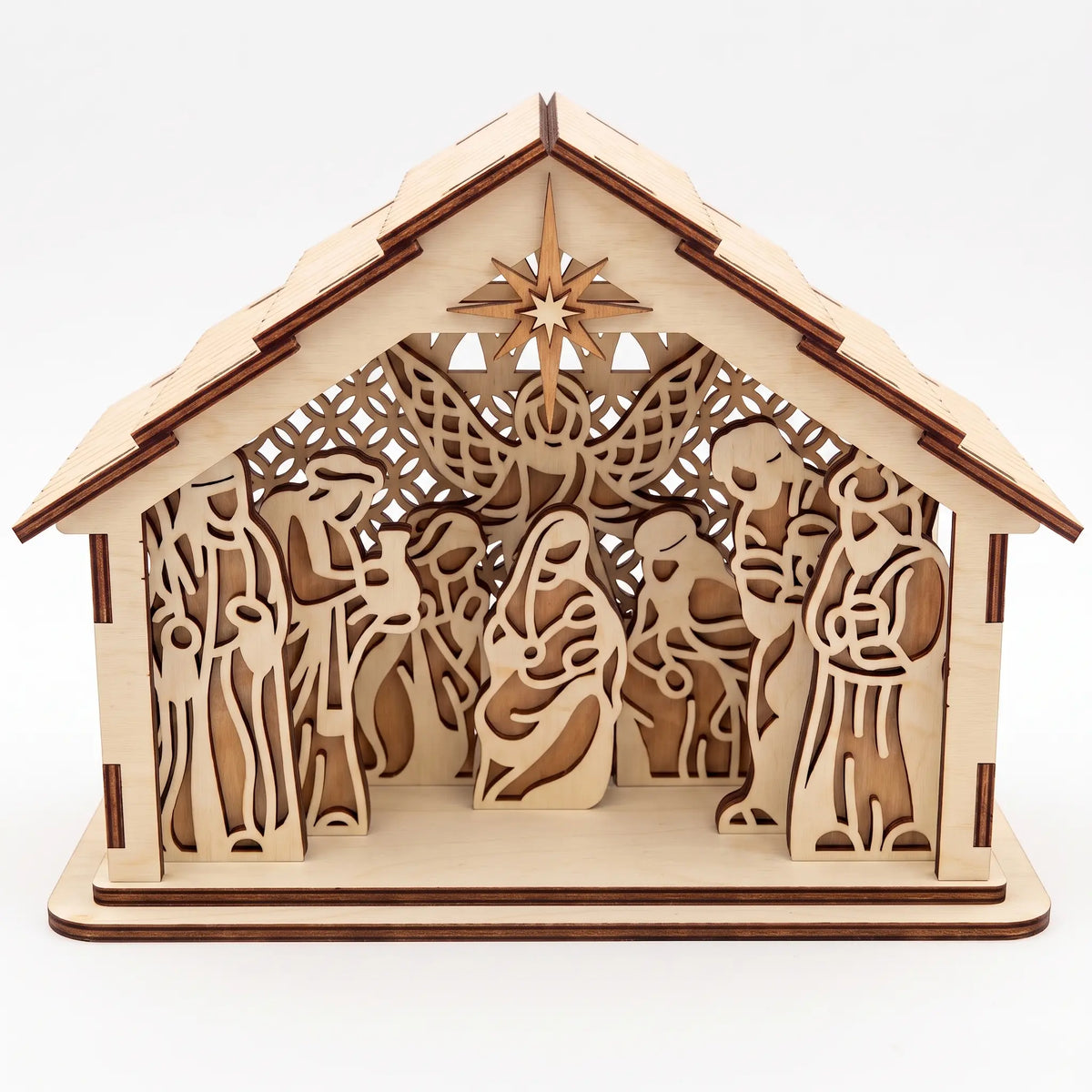 Front direct shot of laser cut plywood holy family nativity barn with carved star on plain white.
