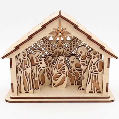 Front direct shot of laser cut plywood holy family nativity barn with carved star on plain white.