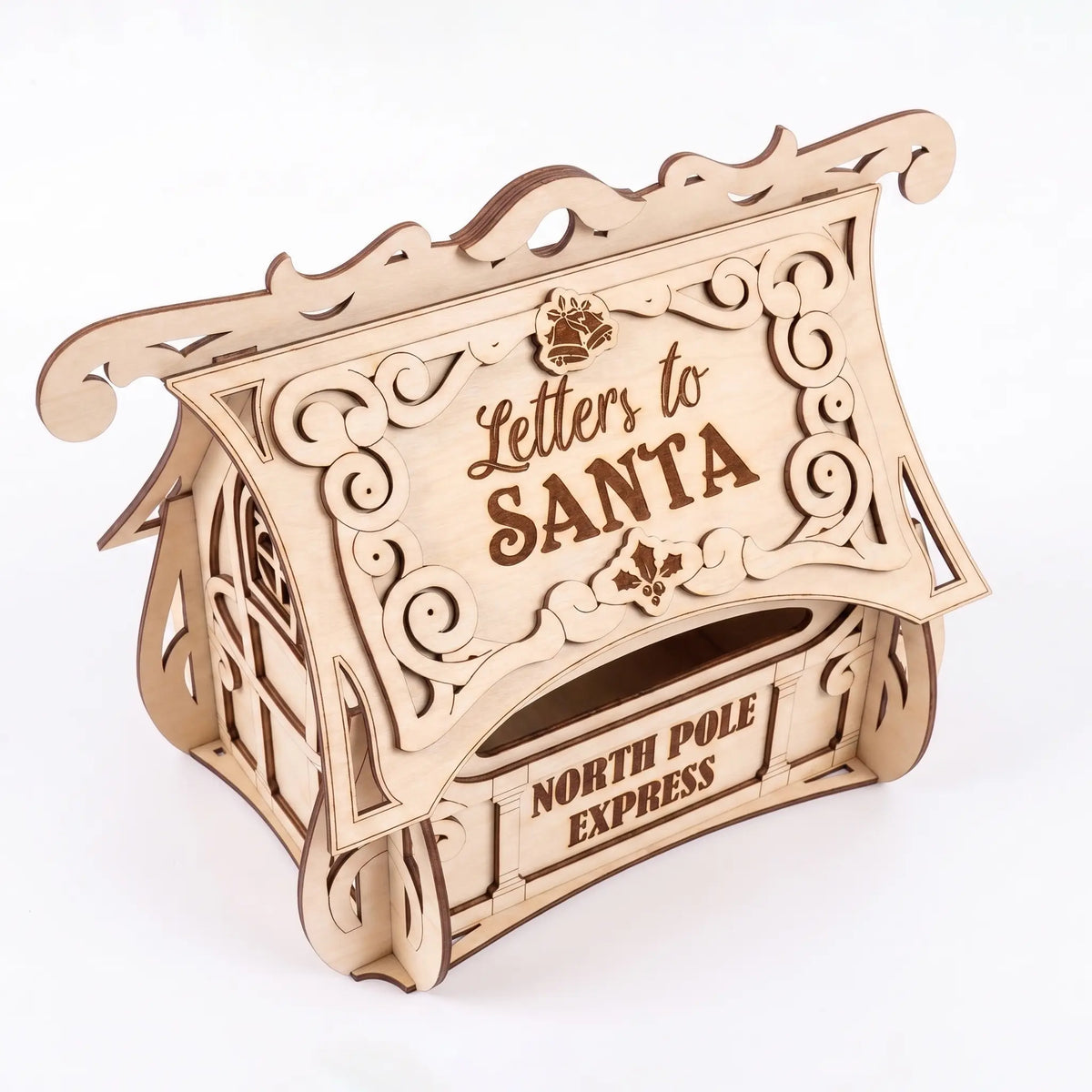 Three-quarter view of a laser cut plywood Letters to Santa post box with ornate roof scrolls on plain white backdrop