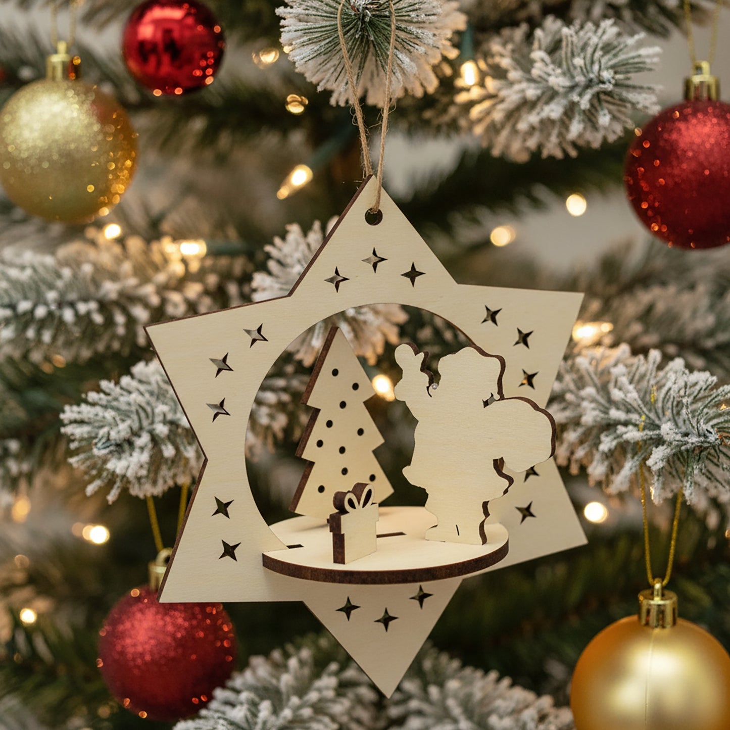 Intricate laser cut Christmas Santa toy with 3D scene of Santa, Christmas tree and presents within a hanging star silhouette, set against a festive flocked Christmas tree lights background.