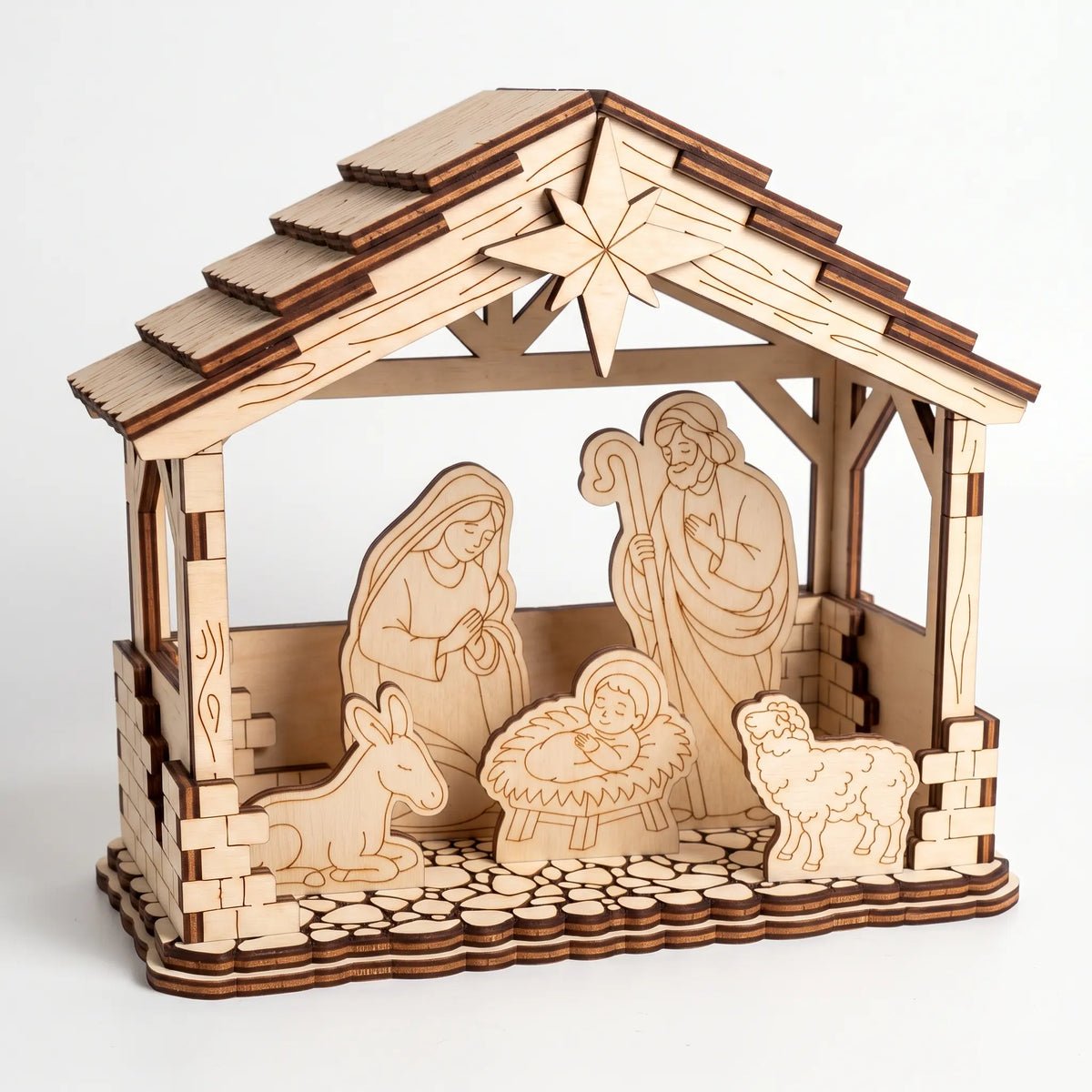 Front three-quarter view of laser cut plywood Nativity stable diorama with Holy Family and star on plain white background.