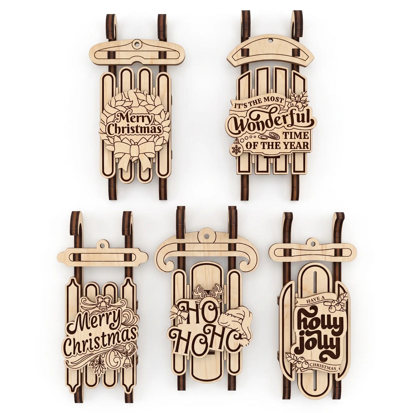 Five wooden laser cut Christmas ornament designs shaped like sleighs, arranged in two rows of three on a plain white background. 