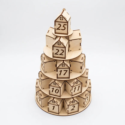Front view of tiered laser cut plywood Christmas tree advent calendar with numbered house boxes on white.