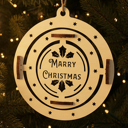 Laser cut wooden Christmas tree toy Merry Christmas with a spinning inner circle featuring holly leaves and "Marry Christmas" engraving, displayed against a warm twinkling Christmas tree background.
