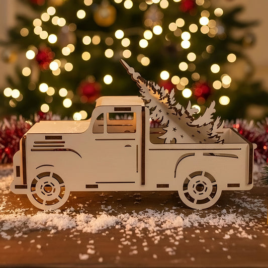 Laser cut wooden Christmas truck with Christmas tree ornament carrying a detailed cut-out fir tree in the bed, displayed against a glowing Christmas tree bokeh background.
