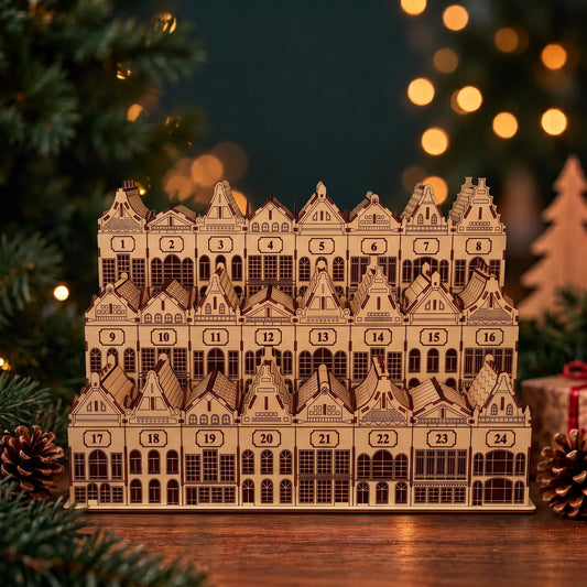 Three-tier laser cut plywood Christmas village advent calendar with numbered house boxes beside fairy lights.