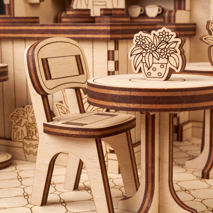 Wooden chair and table set with decorative elements in a warm-toned room.