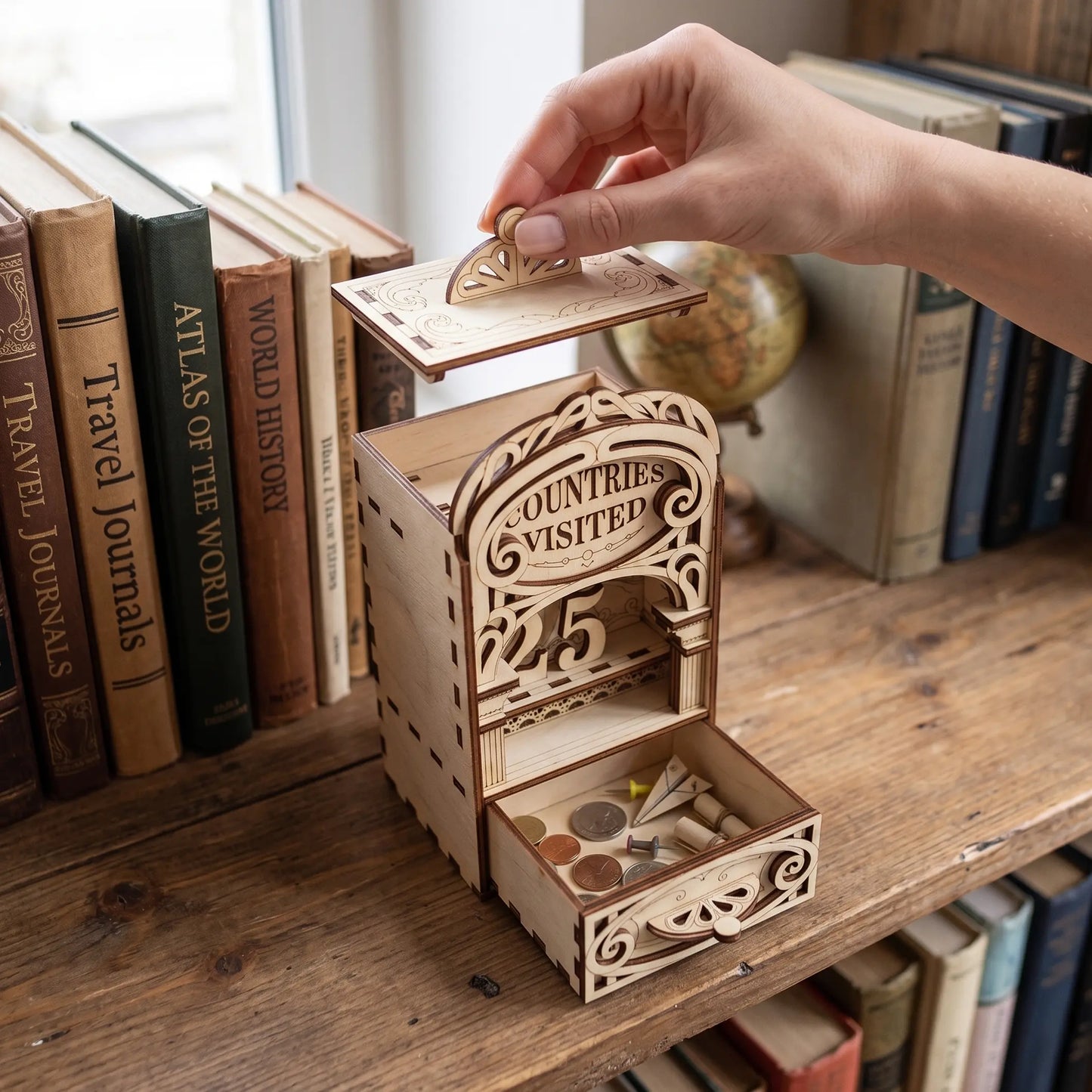 Laser cut Countries Visited wooden book nook with removable top lid and drawer for travel pins, coins, and keepsakes.