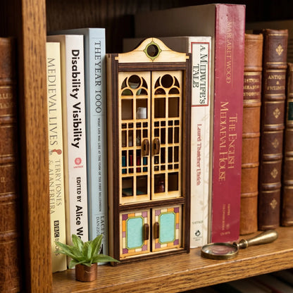 Wooden cupdoard blaser cut book nook with books on the shelf