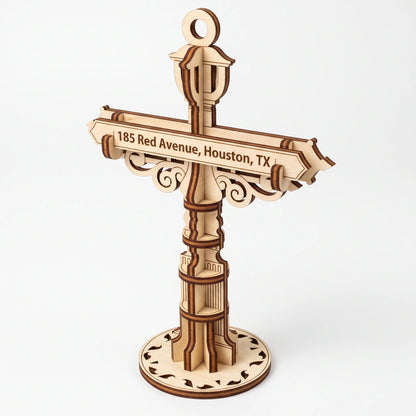 3D laser cut plywood custom street signpost ornament with engraved address plaque and decorative lantern on white backdrop.