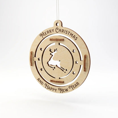 Flat view of hanging laser cut plywood bauble featuring leaping deer silhouette and engraved holiday text on white