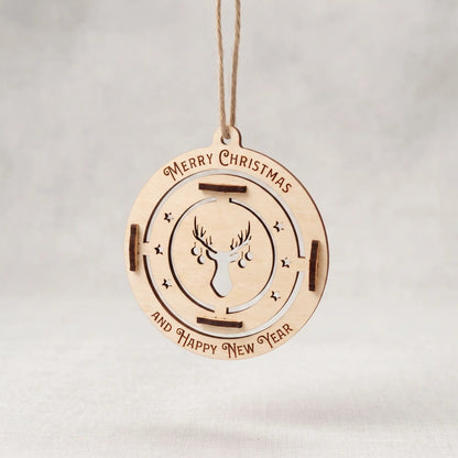 Flat hanging laser cut plywood bauble ornament with stag head cutout and engraved Merry Christmas text on grey.