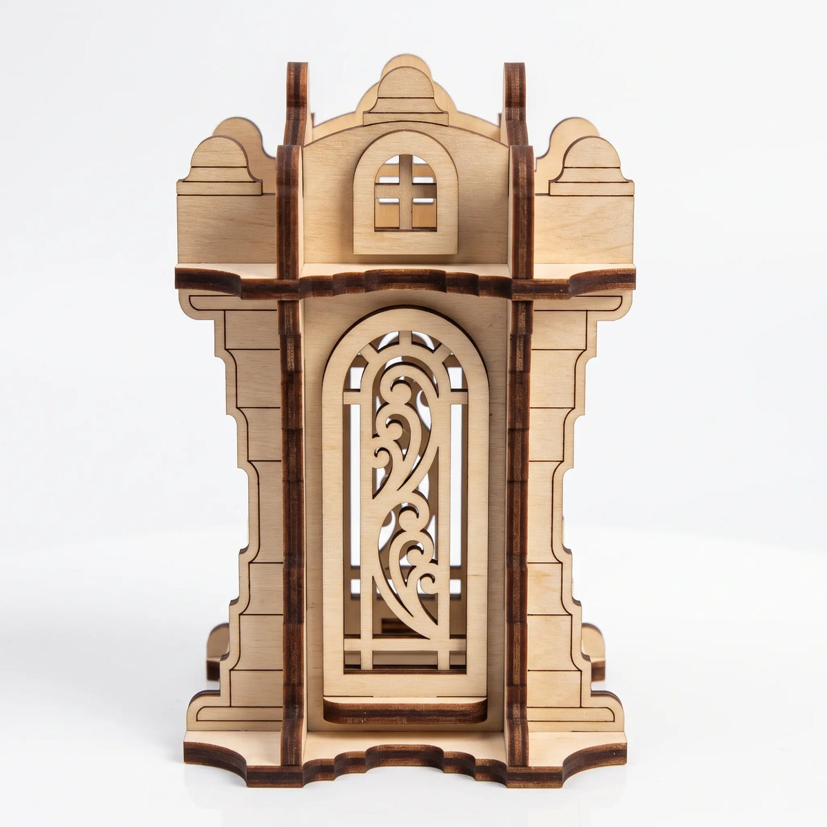 Front view of 3D laser cut plywood tower lantern featuring ornamental arch window and battlements on plain white backdrop.