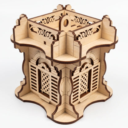Top angle view of laser cut plywood square architectural lantern with carved balustrade and shutter windows on white base.