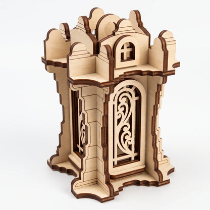 Isometric view of 3D laser cut plywood tower lantern with filigree arched panels and battlements on plain white background.