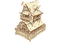 Load image into Gallery viewer, Laser cut wooden model of a Garden Gnome House, featuring a veranda, curved roof, and two floors.

