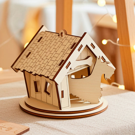 Laser cut miniature plywood wooden horse stable model with a shingled roof and a horse silhouette cutout in the front, sitting on a natural linen cloth next to a framed picture, potted succulent, and warm fairy lights on a wooden shelf