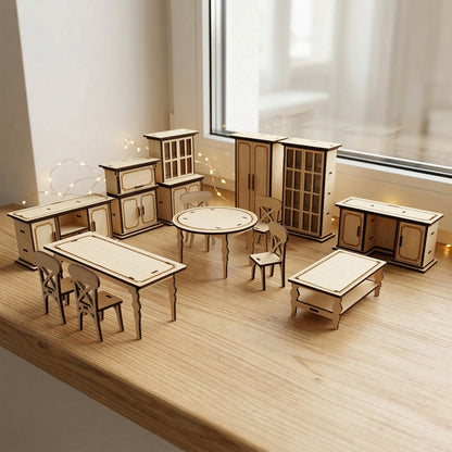 A collection of miniature laser cut plywood dollhouse furniture including tables, X-back chairs, and cabinets with closed doors. Handcrafted 1:12 scale wooden pieces with natural grain and dark burnt edges arranged on a light wood windowsill.