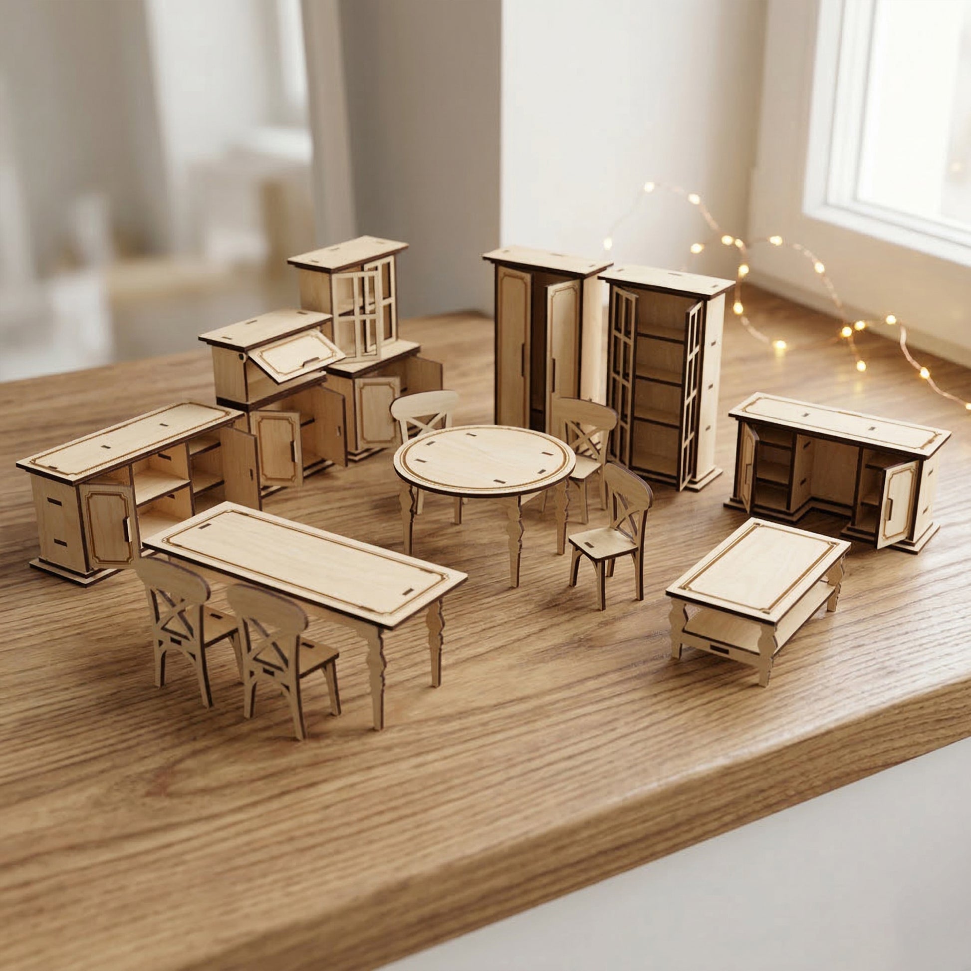 Detailed view of laser cut plywood dollhouse furniture with cabinet doors and drawers open, revealing interior shelves. Miniature tables and X-back chairs shown in 1:12 scale, highlighting the functional design and natural wood textures.