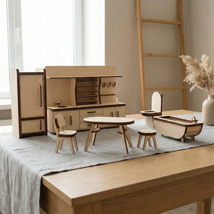 Miniature kitchen and bathroom furniture crafted from laser cut plywood. Features a tall refrigerator, a kitchen unit with a sink, a dining table with chairs, and a bathtub. The clean wooden edges and realistic details create a modern look.