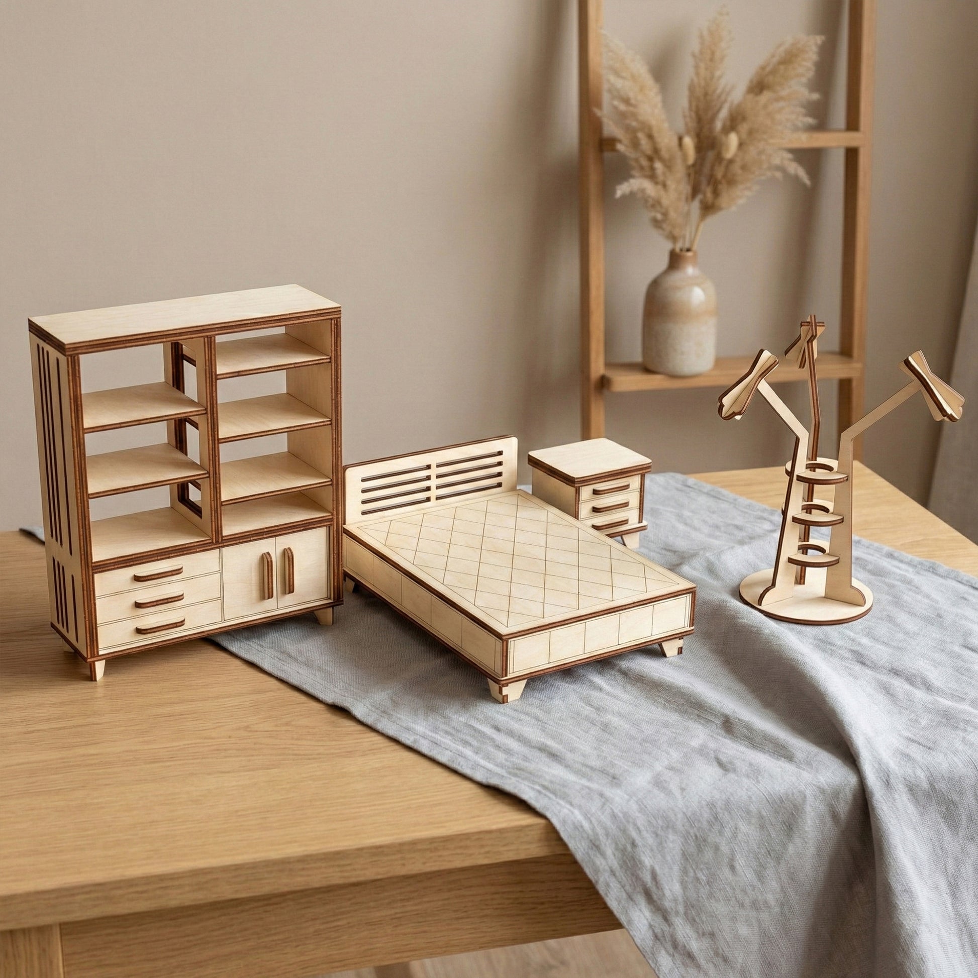Dollhouse bedroom furniture set made of laser cut plywood. Features a large bed with a diamond-patterned engraving, a matching nightstand, and a tall bookcase with drawers. A multi-arm floor lamp completes this cozy wooden miniature scene.