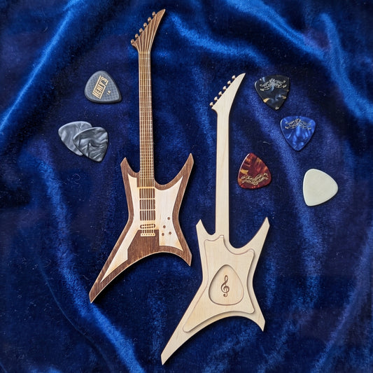 Laser cut plywood electric guitar pick holder with plectrum slot on blue velvet fabric surrounded by colorful guitar picks.