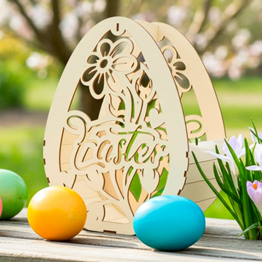 Light brown laser cut  plywood wooden egg-shaped basket with floral design and "Easter" text, sitting on a weathered wooden railing outdoors, surrounded by colored eggs and blooming crocuses