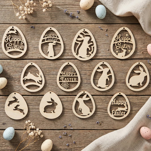 A collection of twelve unique laser-cut plywood Easter egg ornaments featuring various bunny silhouettes, floral patterns, and "Happy Easter" engravings. The handcrafted wooden tags are arranged in a flat lay on a rustic wooden surface with pastel speckled eggs, lavender, and dried baby's breath flowers.