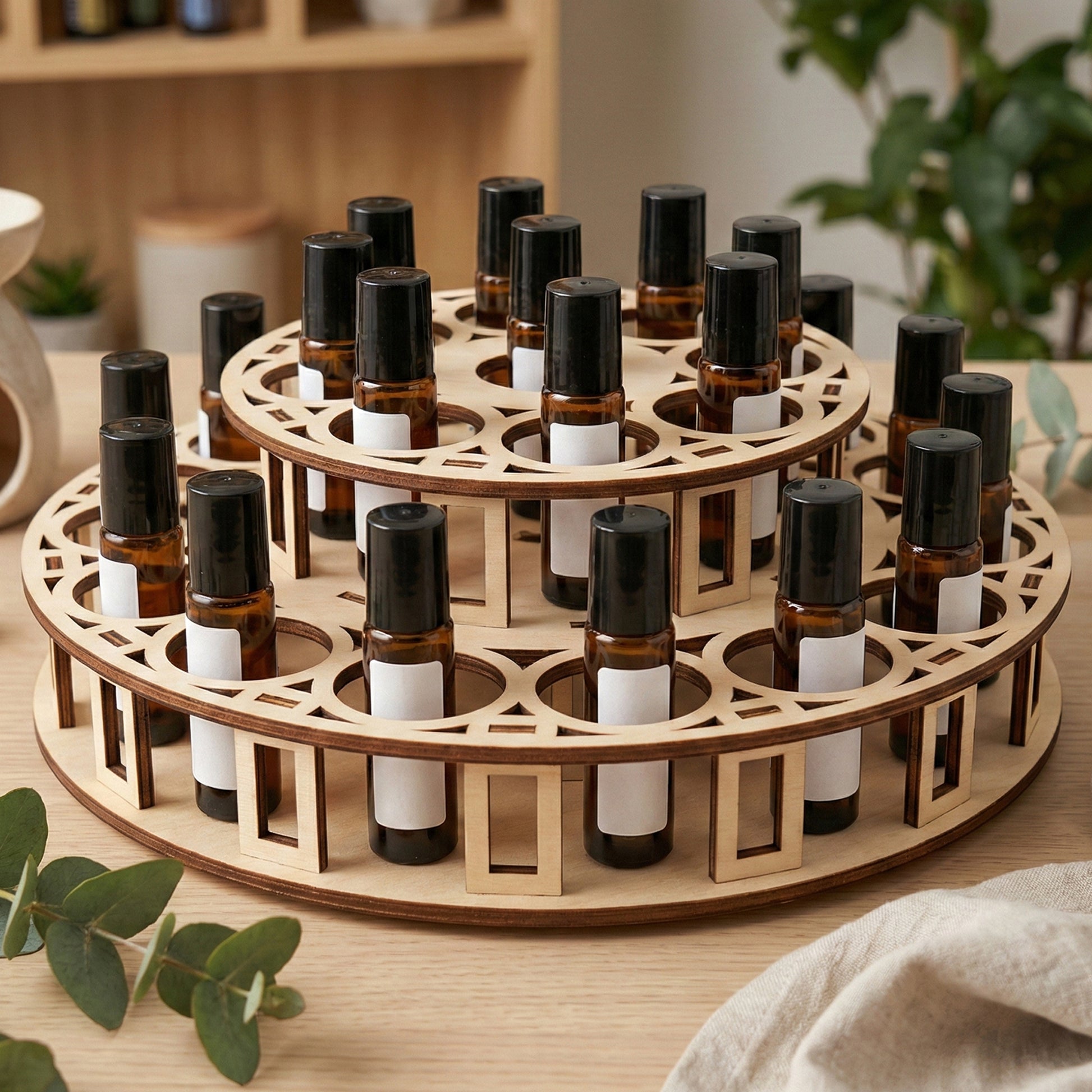 2-tier circular laser cut  woodeb plywood essential oil display stand made of light birch plywood, holding multiple dark amber glass roller bottles.
