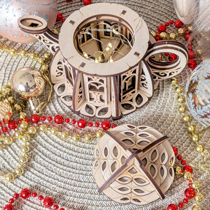 Top-down view of laser cut fairy kettle house showing interior LED lighting and detailed plywood construction