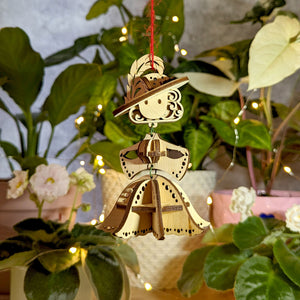 Laser cut design: fairy ornament with delicate features.