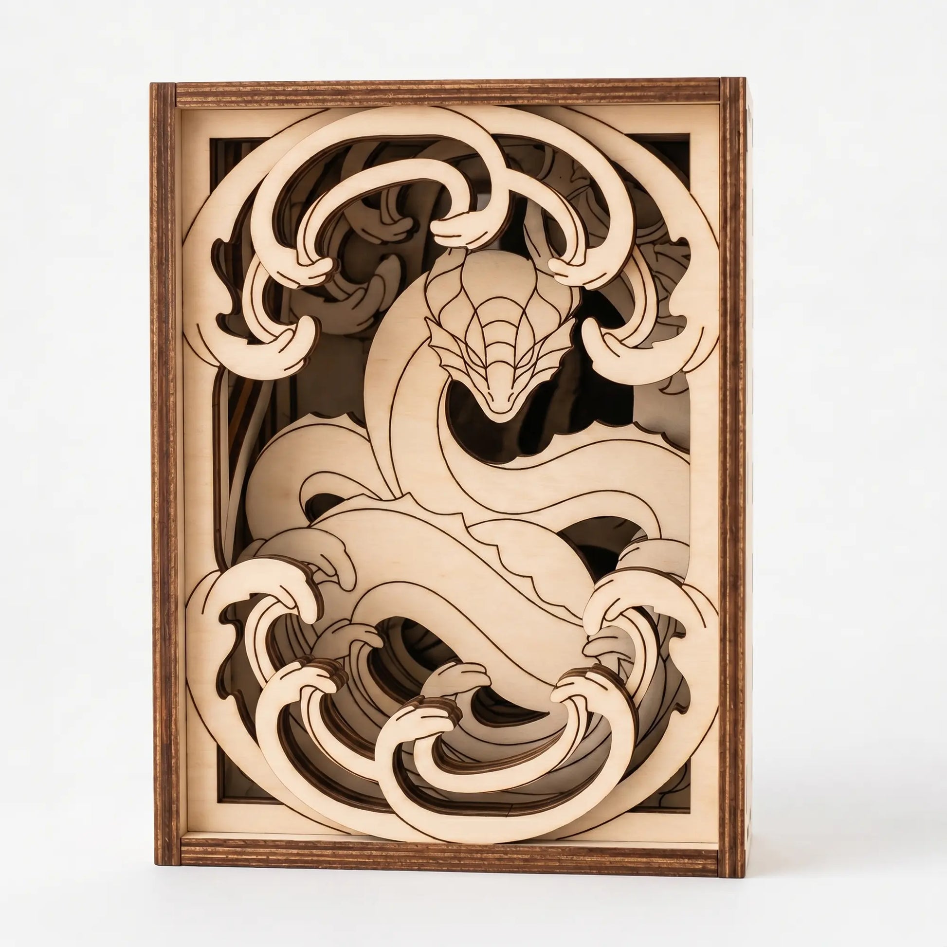 Wooden laser cut dragon sculpture with intricate design on a white background