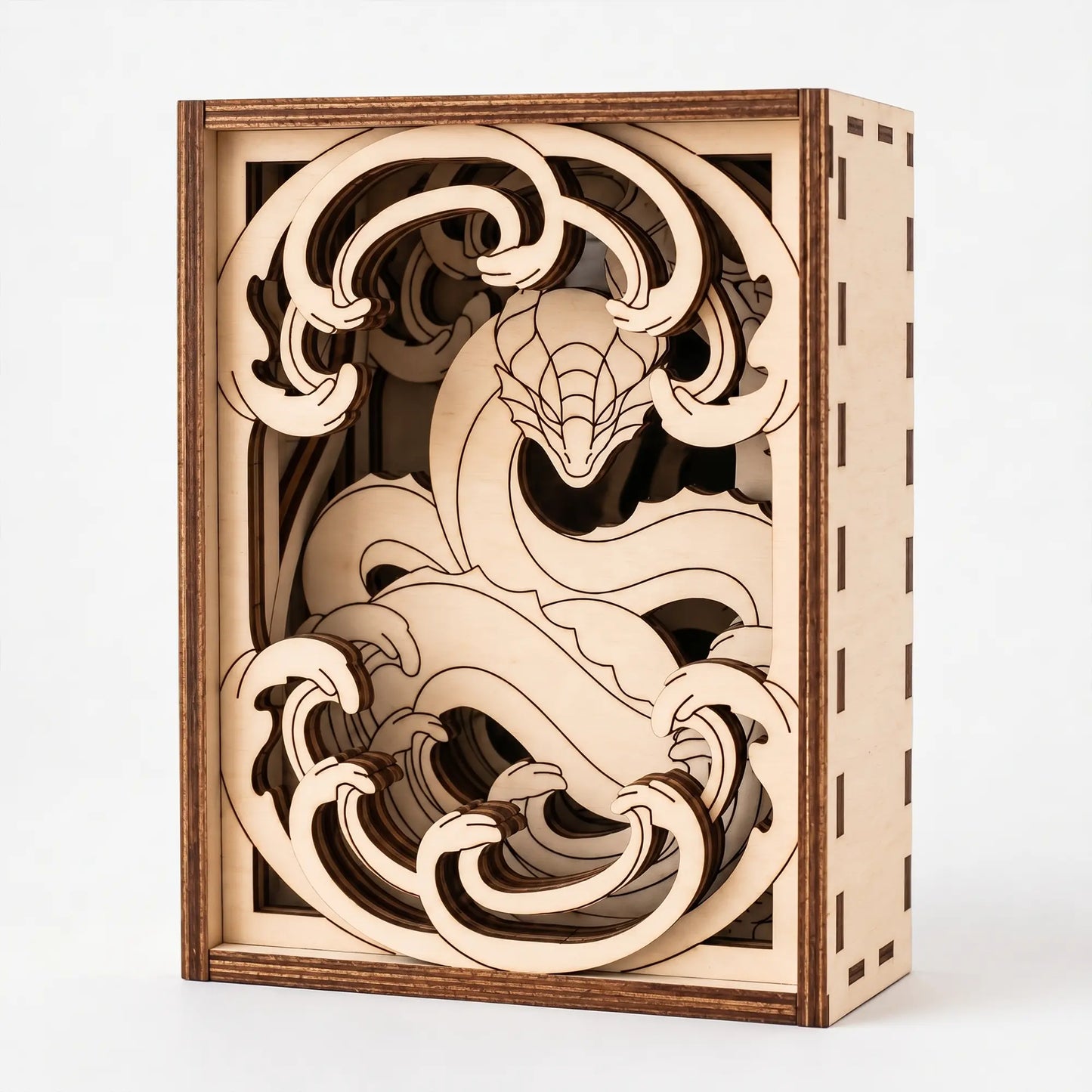 Wooden dragon laser cut puzzle box with intricate cut-out design on a white background