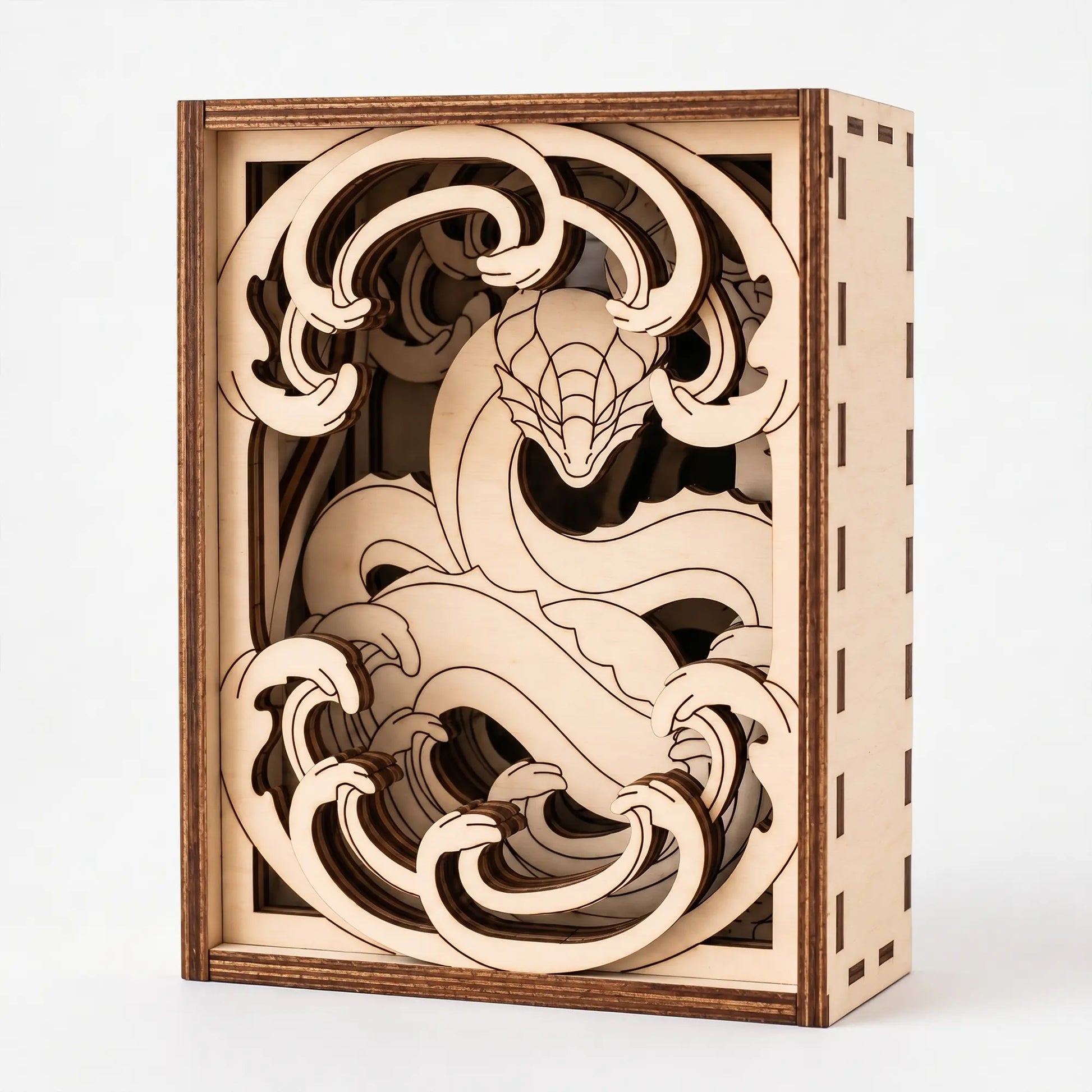 Wooden dragon laser cut puzzle box with intricate cut-out design on a white background