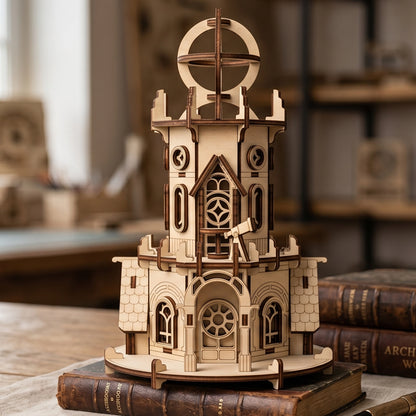 Intricate laser cut plywood astronomical observatory model resting on vintage books. Shows detailed arched windows & doors.