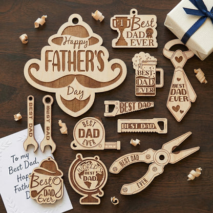 A large collection of Father's Day gift tags and keychain charms made from laser-cut plywood. Designs include a mustache, wrenches, saws, a tape measure, and a beer mug, all featuring "Best Dad Ever" and "World's Best Dad" engravings on a dark wood background.
