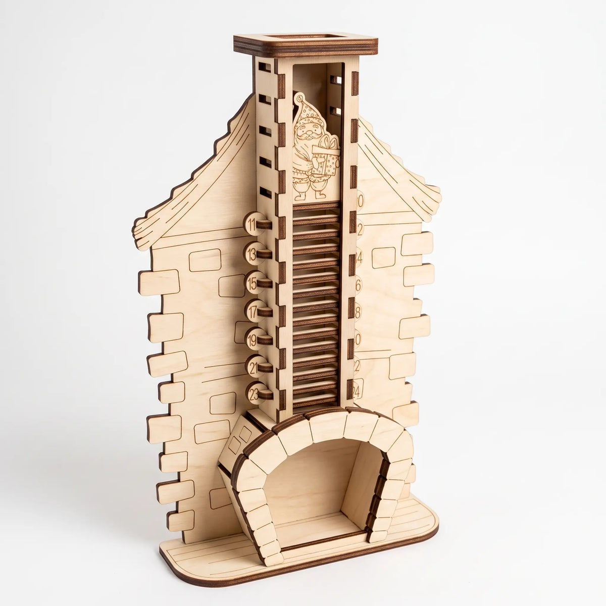 Angled view of standing laser cut plywood fireplace chimney countdown calendar with numbered slots on white backdrop