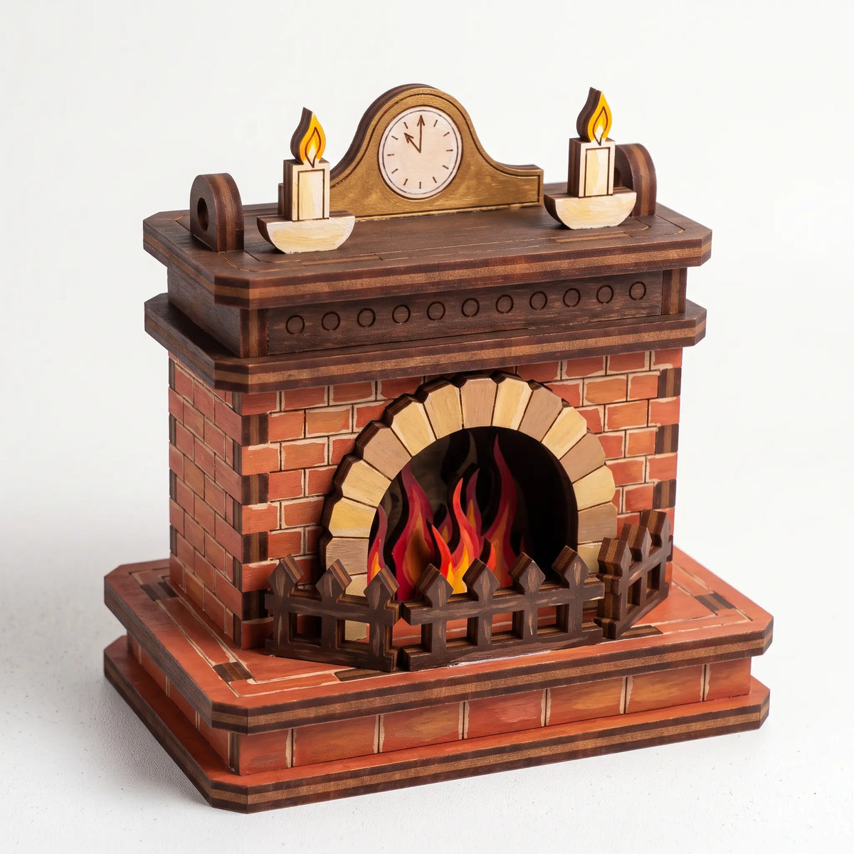 Painted 3D laser cut plywood fireplace model with mantle clock, candles, and hearth fence against plain white background.