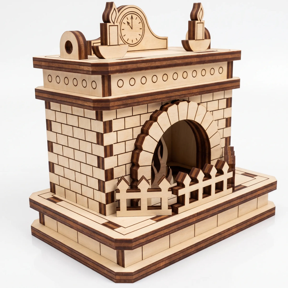 Isometric perspective view of laser cut plywood miniature fireplace with brick pattern, clock, and fence on white backdrop.