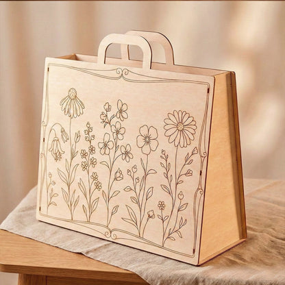 A laser cut plywood gift box with a floral design on the front cover.