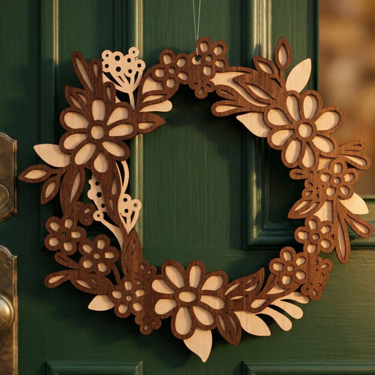 A handcrafted layered laser-cut plywood floral wreath hanging on a dark green door. The spring-themed design features intricate daisies and leaf patterns in contrasting light and dark wood tones. Warm natural light highlights the wood grain and the 3D depth of the piece.