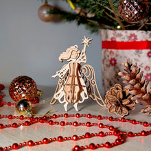 Load image into Gallery viewer, Elegant angel ornament holding a star, designed for laser cutting projects
