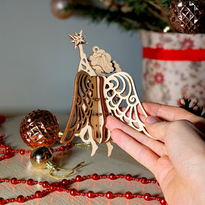 3D Christmas angel ornament holding a star, created from laser-cut files